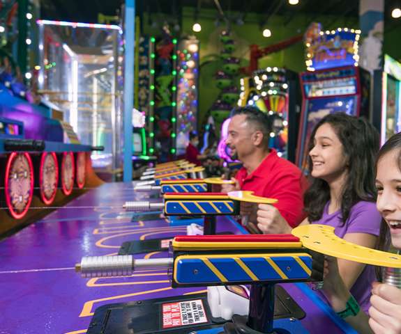 Family playing in the arcade
